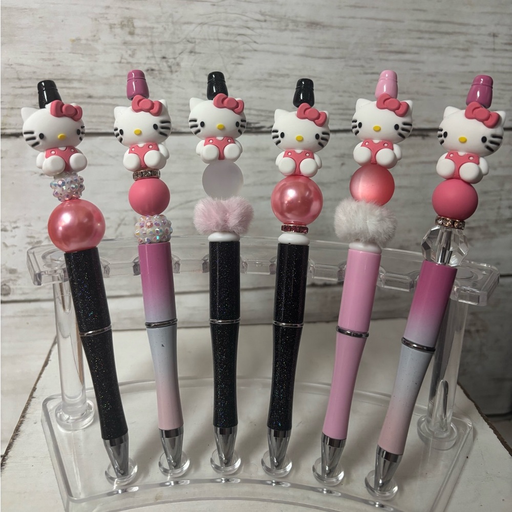 Hello kitty pens, keychains, and Stanley charms